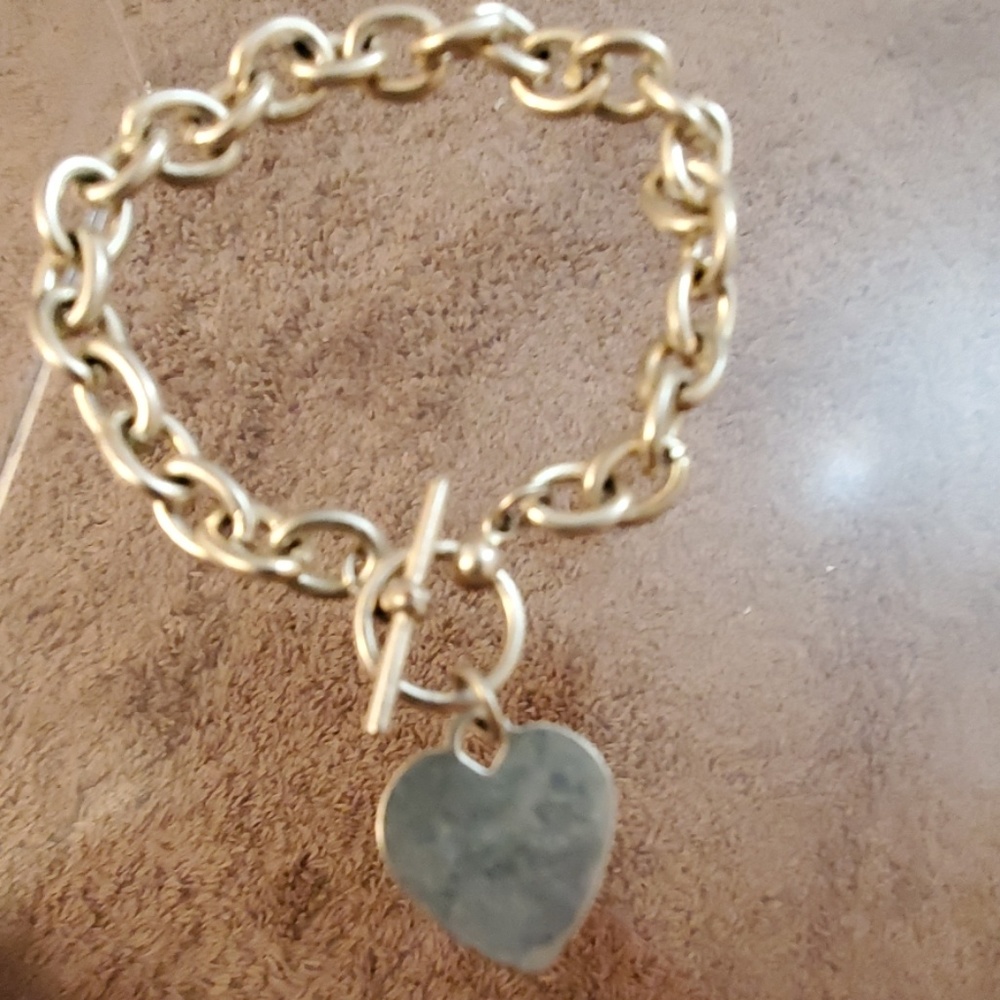 silver bracelet with heart pendant